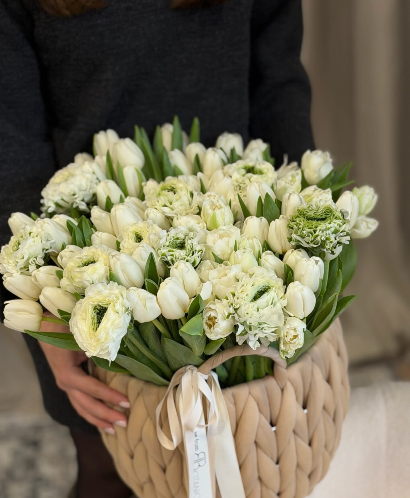 50 tulips and 20 ranunculus in a basket